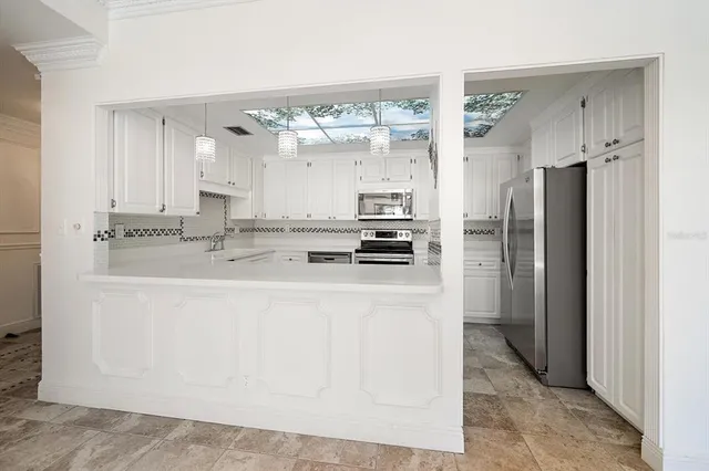 a view of swimming pool with patio