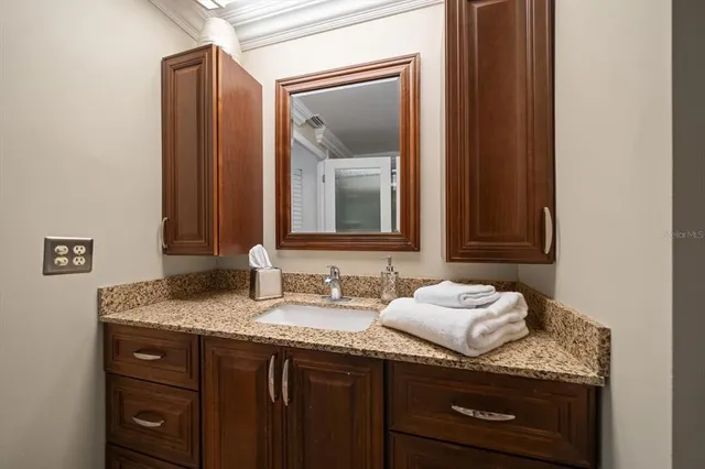 a view of a balcony with two chairs and a table
