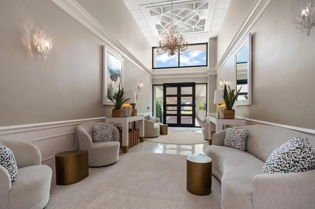 a front view of a house with a yard and lake view