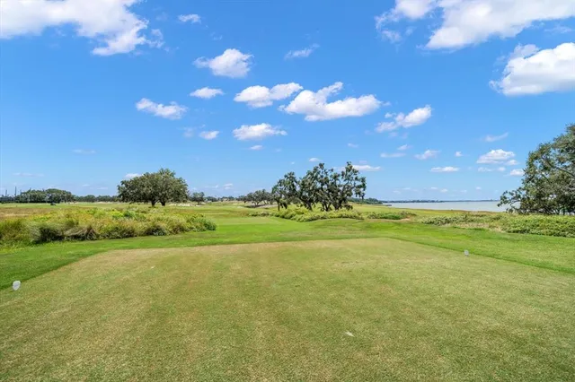 a view of a chairs and table in patio with potted plants