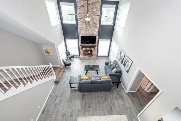a living room with furniture and a fireplace