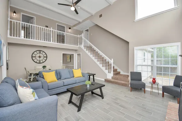 a living room with furniture and a large window