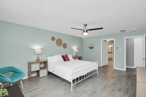 a bedroom with a bed and a table