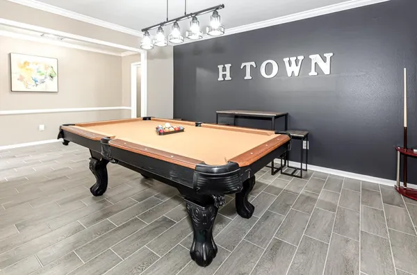 a room with table tennis table and windows