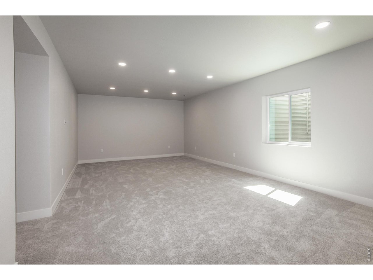 792 Chatter Road Windsor, CO 80550 - Photo 33 of 49 a view of an empty room with a window