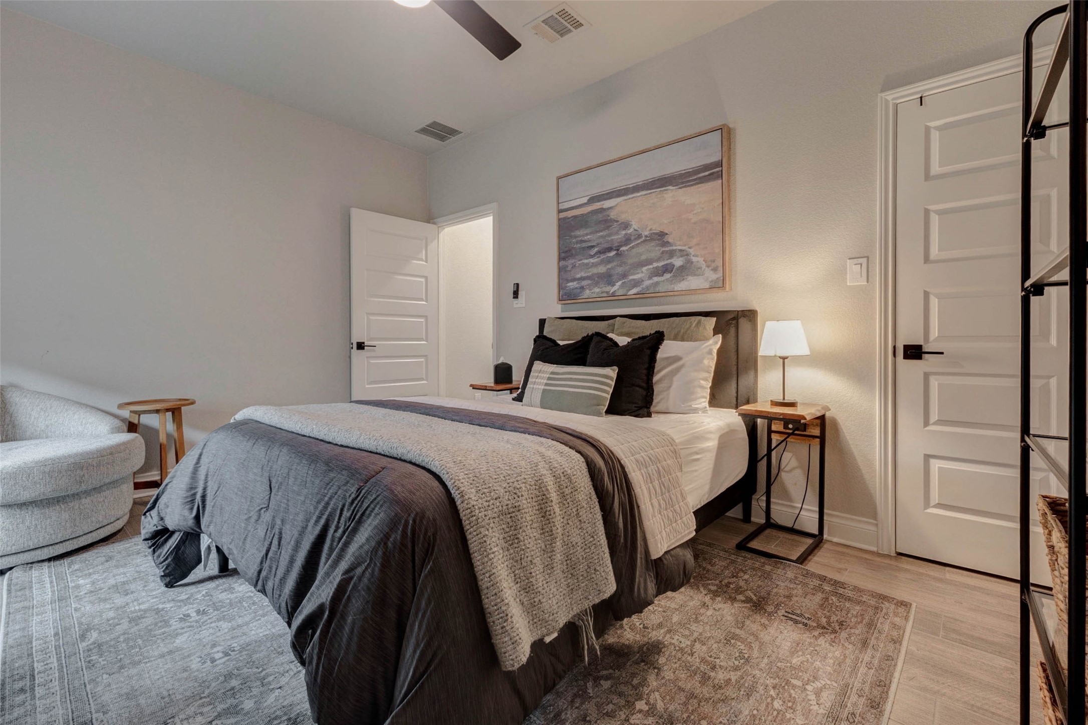 4303 Tupelo Leaf Court Manvel, TX 77578 - Photo 25 of 50 a bedroom with a bed and a painting on the wall