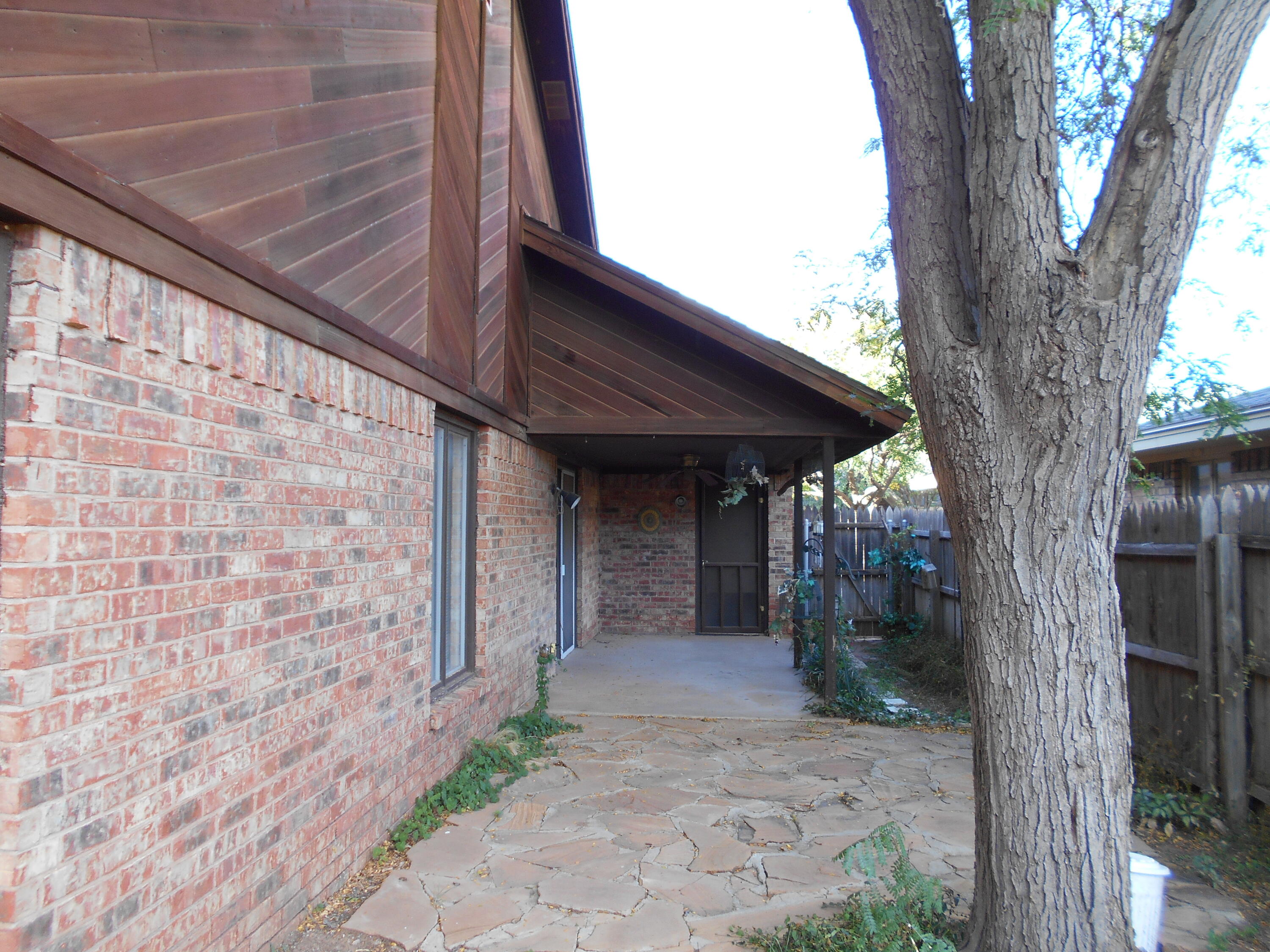 3107 75th Street, Unit A Lubbock, TX 79423 - Photo 12 of 12 a view of a pathway of a house