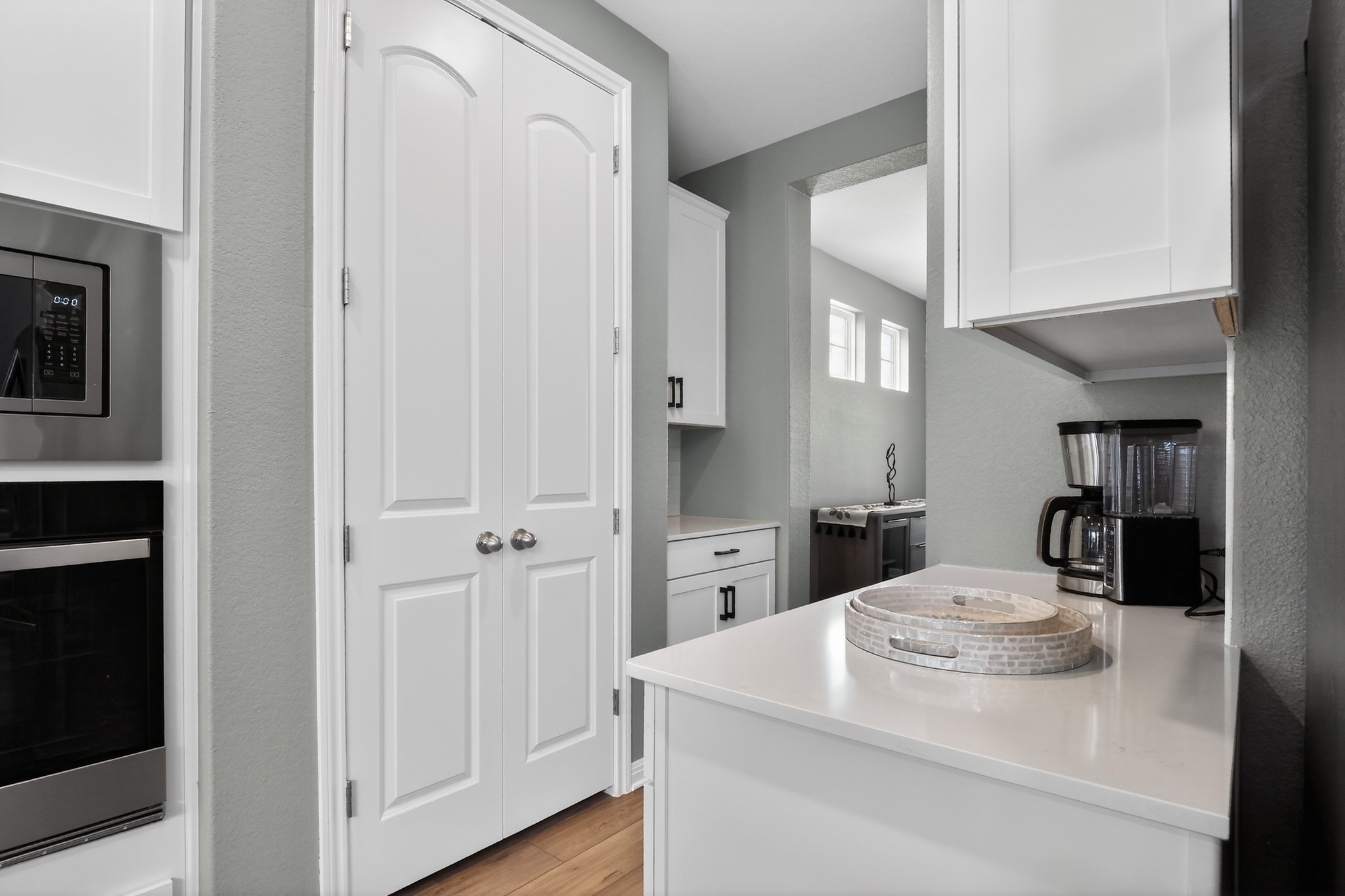 114 Bosco Road Hutto, TX 78634 - Photo 12 of 39 Streamlined kitchen features white cabinetry and light-colored countertops, ready for daily living.