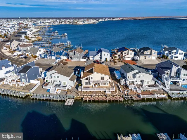 an aerial view of a house with a ocean view
