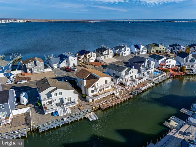 an aerial view of a house with a lake view