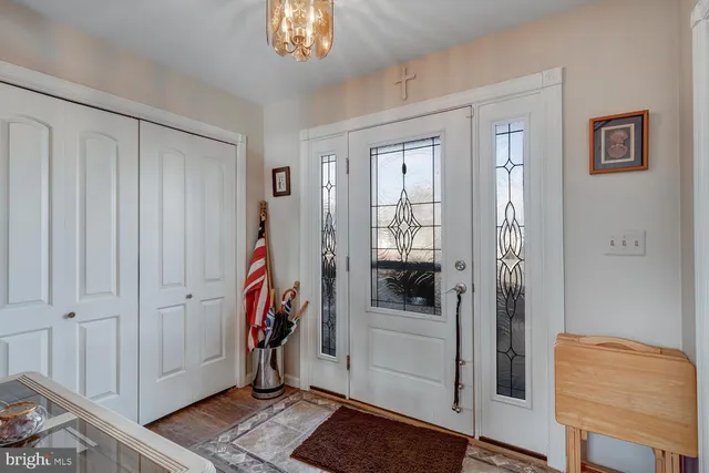 a view of entryway with wooden floor and stairs