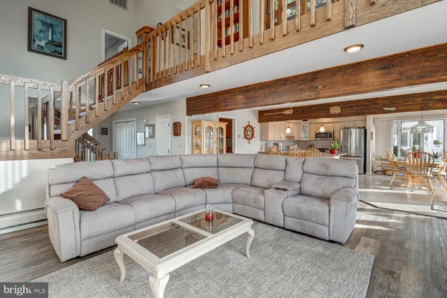 a room with lots of furniture and a table