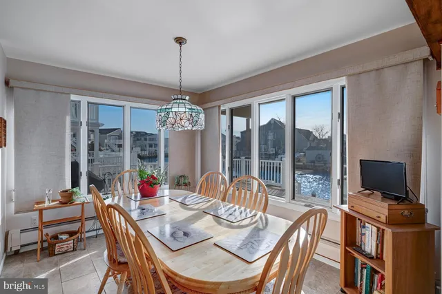 a kitchen with granite countertop a refrigerator sink stove and microwave