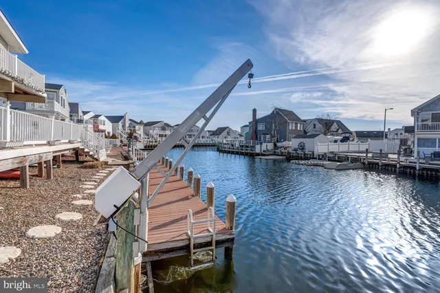 a view of a lake with outdoor seating