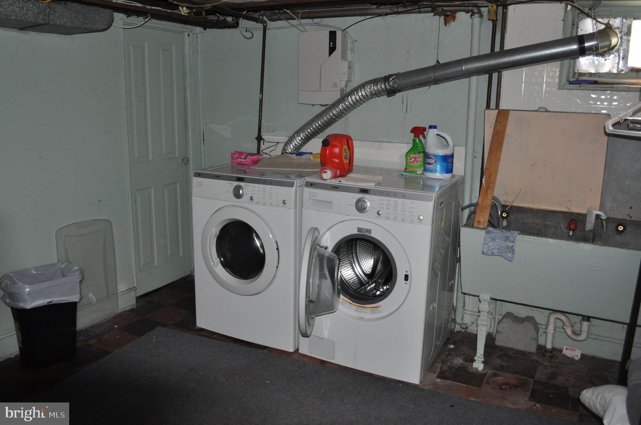 26 Kinship Road Baltimore, MD 21222 - Photo 22 of 24 Rear Basement with front-load washer and dryer