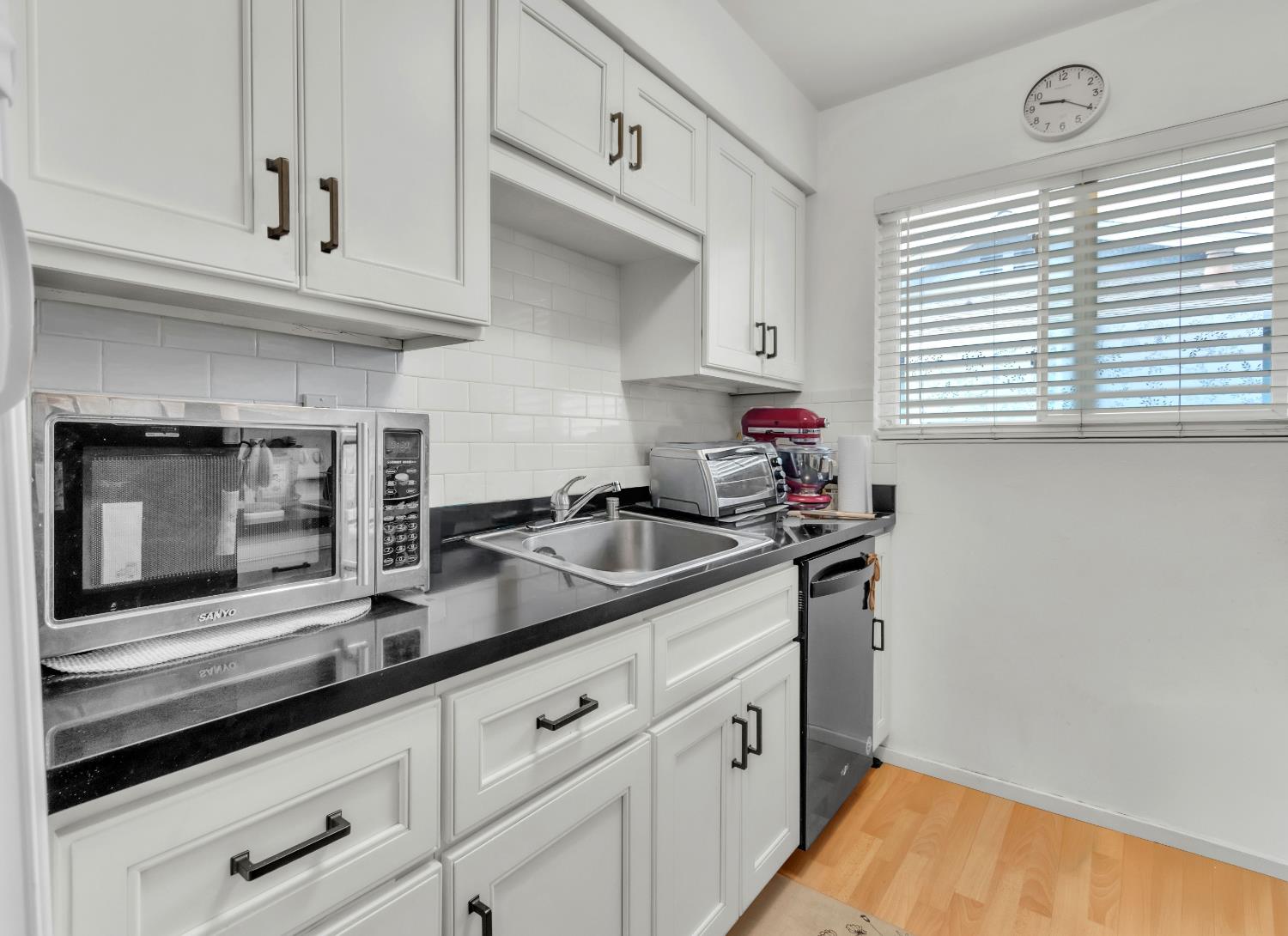 1369 Del Rio Circle, Unit D Concord, CA 94518 - Photo 1 of 21 a kitchen with sink and cabinets