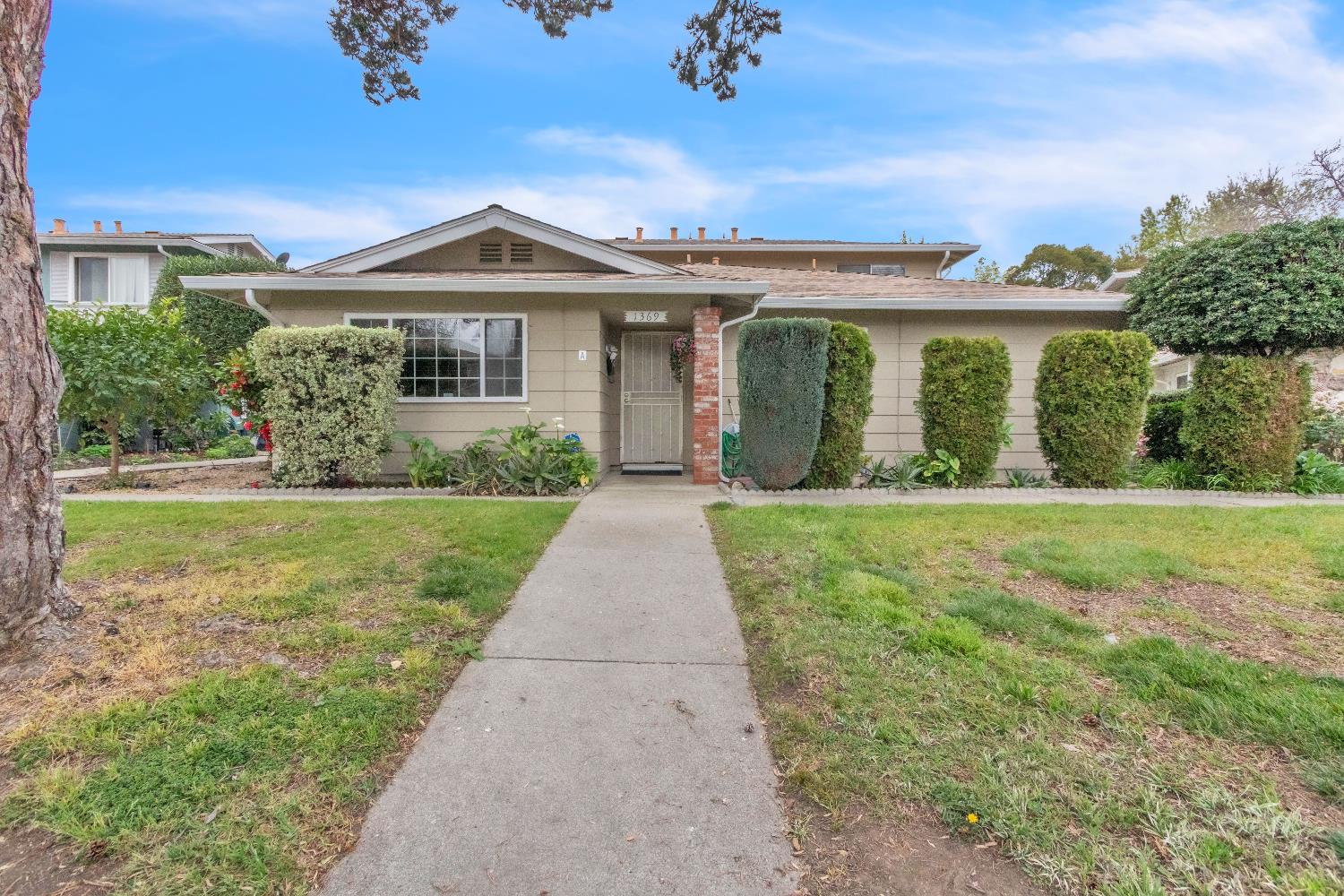 1369 Del Rio Circle, Unit D Concord, CA 94518 - Photo 2 of 21 a front view of house with yard