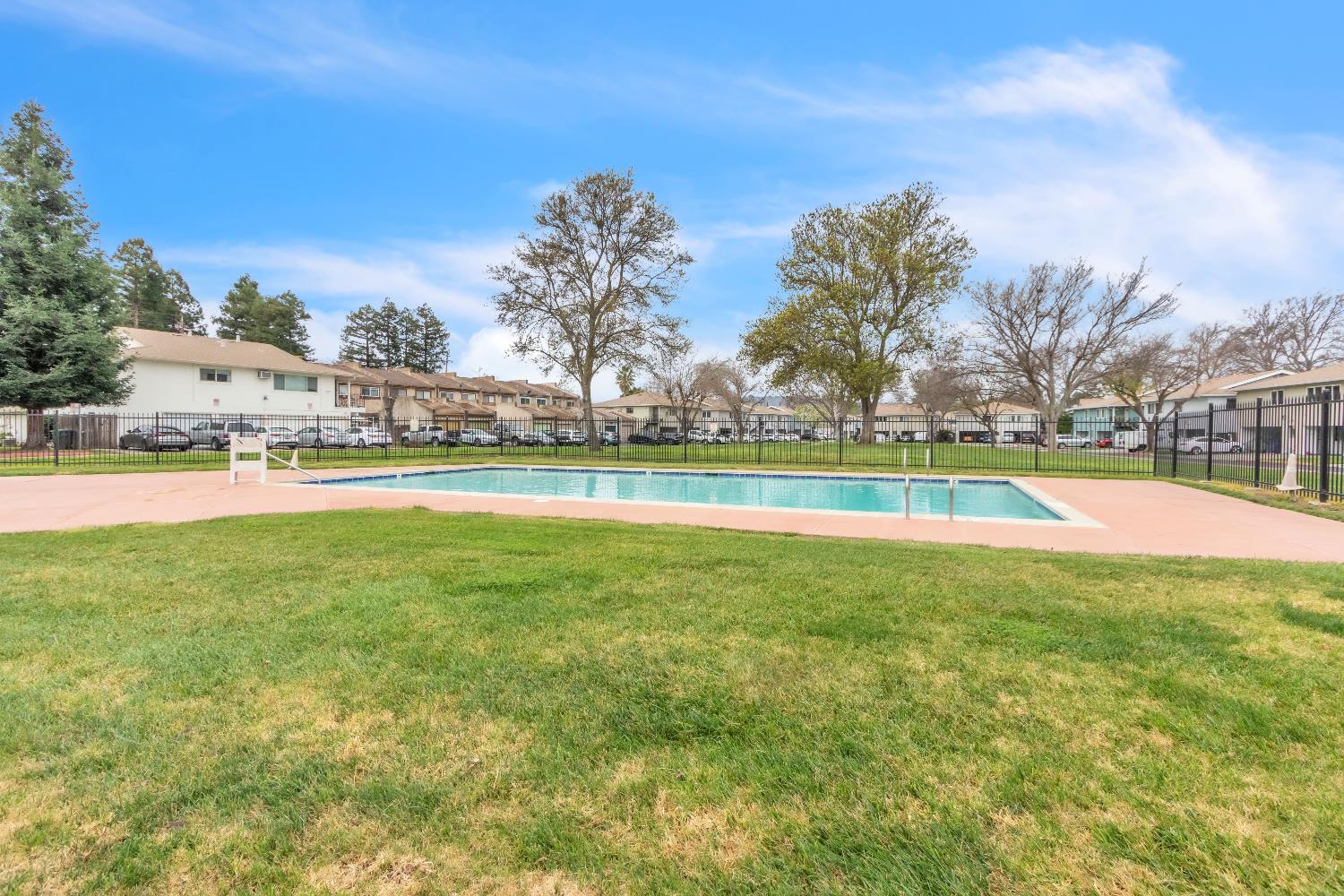 1369 Del Rio Circle, Unit D Concord, CA 94518 - Photo 21 of 21 a view of a swimming pool with an outdoor space and seating area