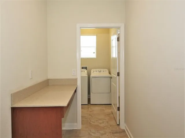 a bathroom with a sink and a washing machine