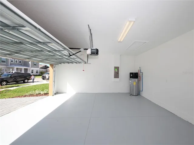 a view of a kitchen with a sink and a microwave