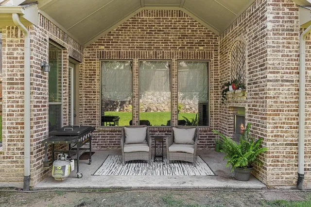 a view of house with outdoor seating space