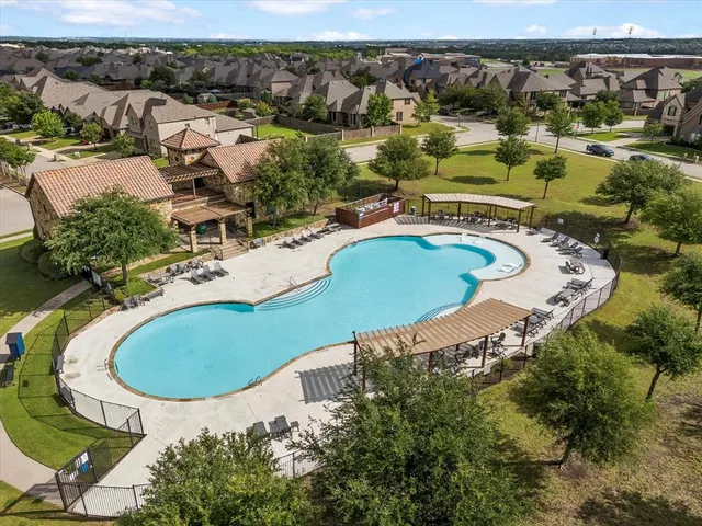 an aerial view of a swimming pool yard and mountain view
