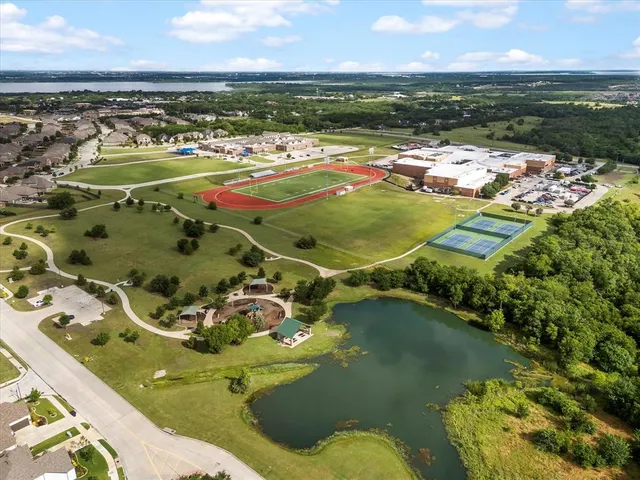 an aerial view of residential houses with outdoor space