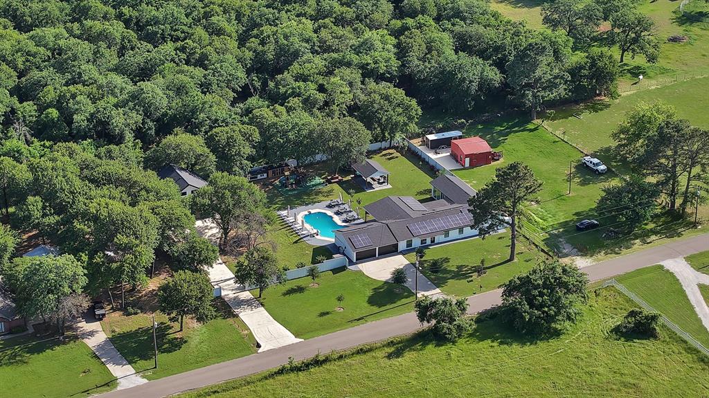 620 East 6th Street Springtown, TX 76082 - Photo 37 of 40 an aerial view of a house with a yard