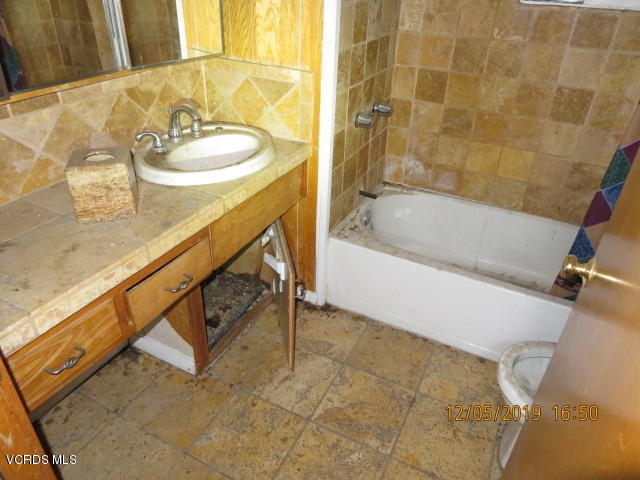 18452 Little Tujunga Canyon Road Canyon Country, CA 91387 - Photo 21 of 61 a bathroom with a sink and a bathtub