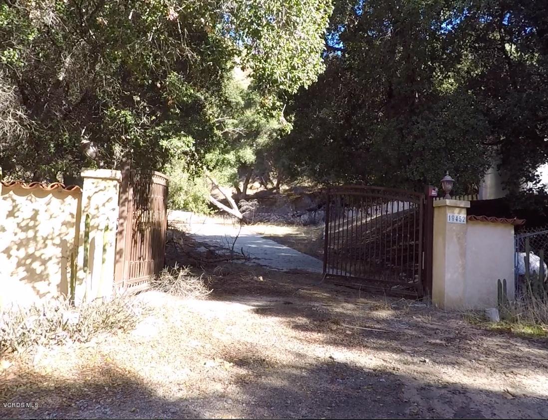 18452 Little Tujunga Canyon Road Canyon Country, CA 91387 - Photo 4 of 61 a view of a yard with large tree and wooden fence