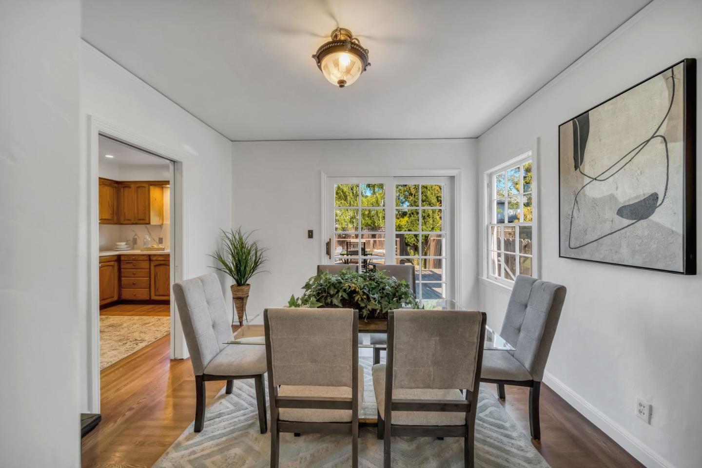 132 Dwight Road Burlingame, CA 94010 - Photo 13 of 69 a view of a dining room with furniture window and wooden floor