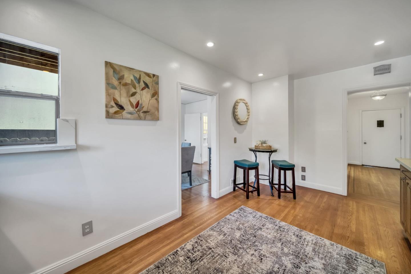 132 Dwight Road Burlingame, CA 94010 - Photo 19 of 69 a view of a dining room with furniture and wooden floor