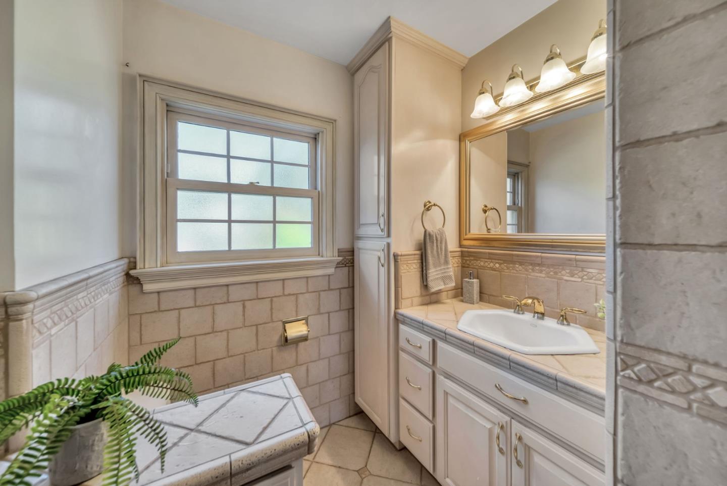 132 Dwight Road Burlingame, CA 94010 - Photo 21 of 69 a bathroom with a sink a vanity and a mirror