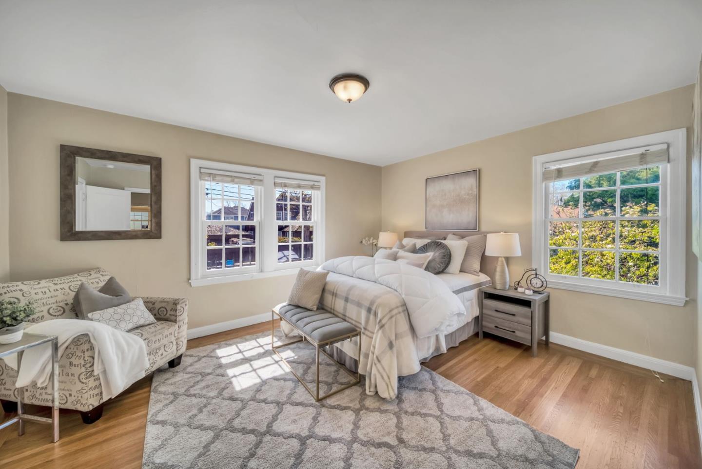 132 Dwight Road Burlingame, CA 94010 - Photo 27 of 69 a spacious bedroom with a bed and wooden floor