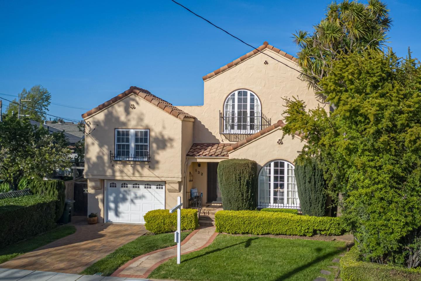 132 Dwight Road Burlingame, CA 94010 - Photo 3 of 69 a front view of a house with a yard