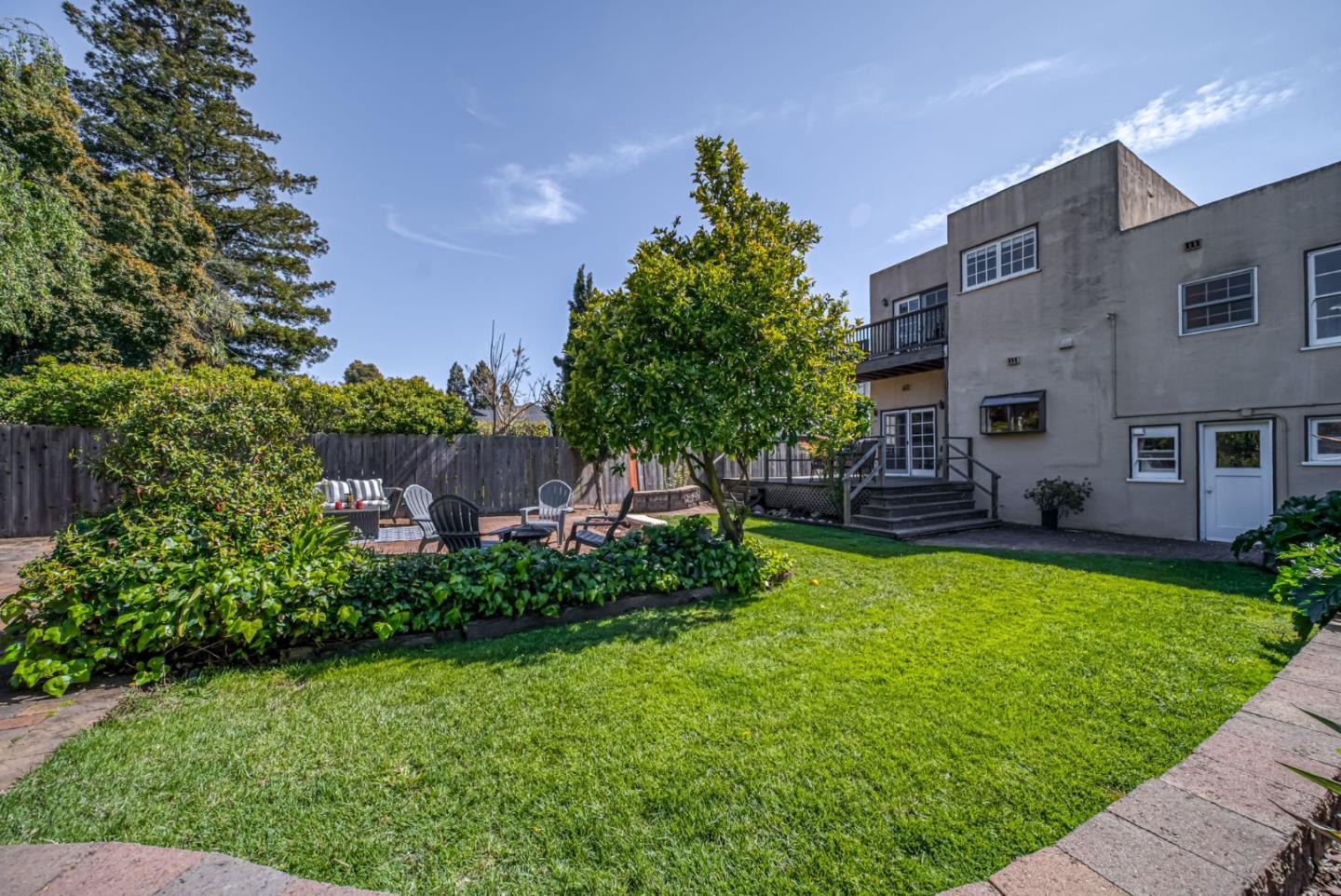 132 Dwight Road Burlingame, CA 94010 - Photo 57 of 69 a backyard of a house with lots of green space and plants