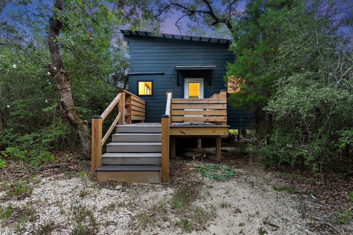 164 Ragtime Ranch Road Elgin, TX 78621 - Photo 1 of 1 Back of property featuring a deck