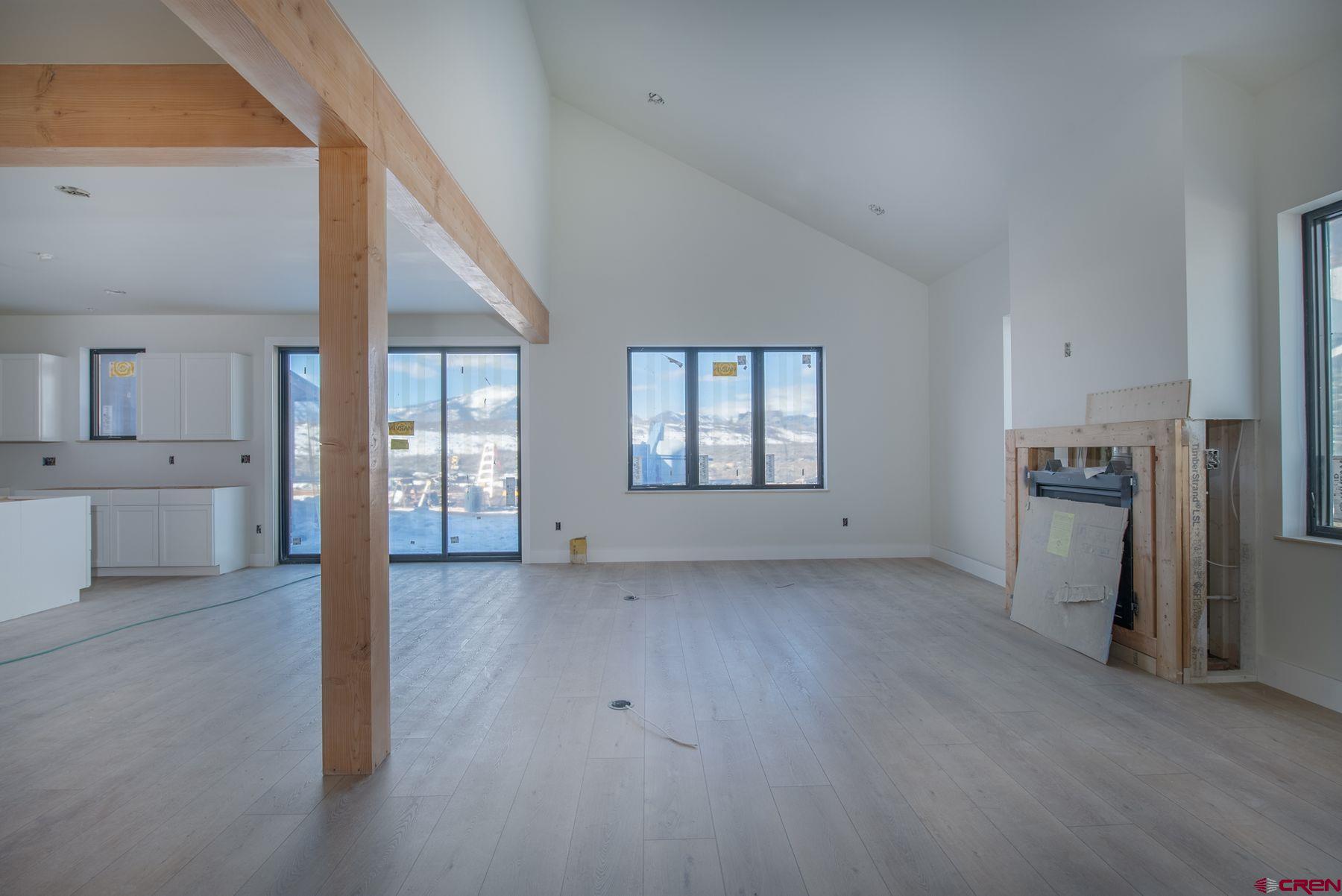 40 Elk Valley Road Crested Butte, CO 81224 - Photo 3 of 25 a view of a big room with windows and kitchen view