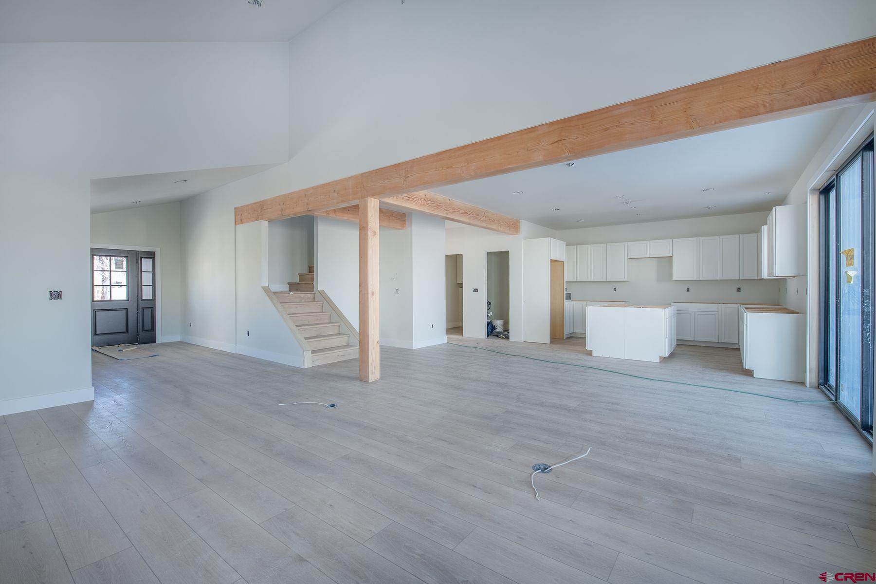 40 Elk Valley Road Crested Butte, CO 81224 - Photo 5 of 25 a view of a livingroom with wooden floor and closet