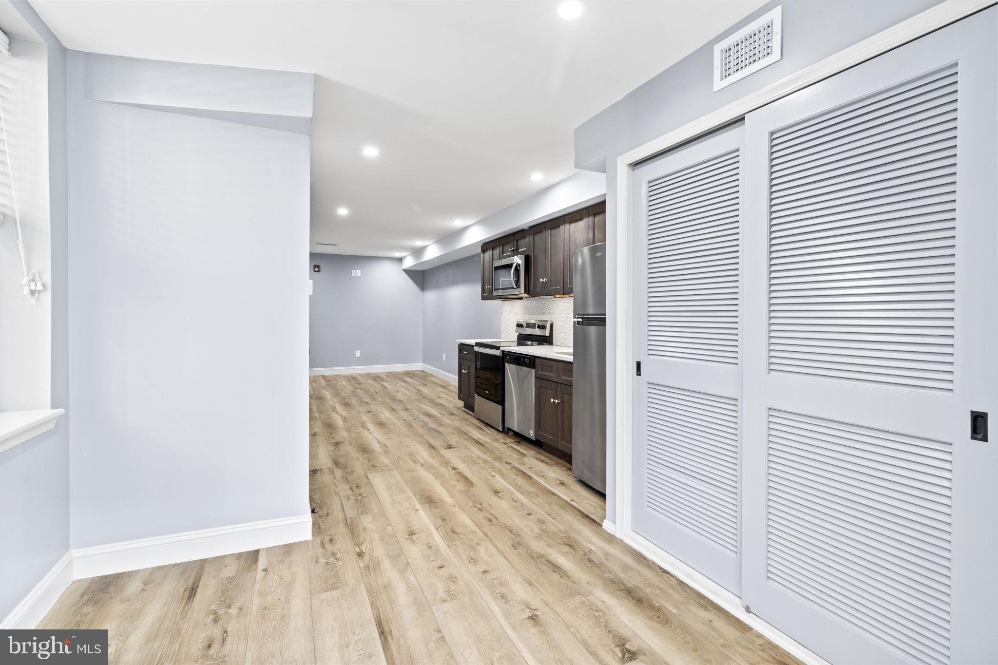 418 South 15th Street, Unit 2R Philadelphia, PA 19146 - Photo 11 of 26 a view of kitchen view with wooden floor and cabinets