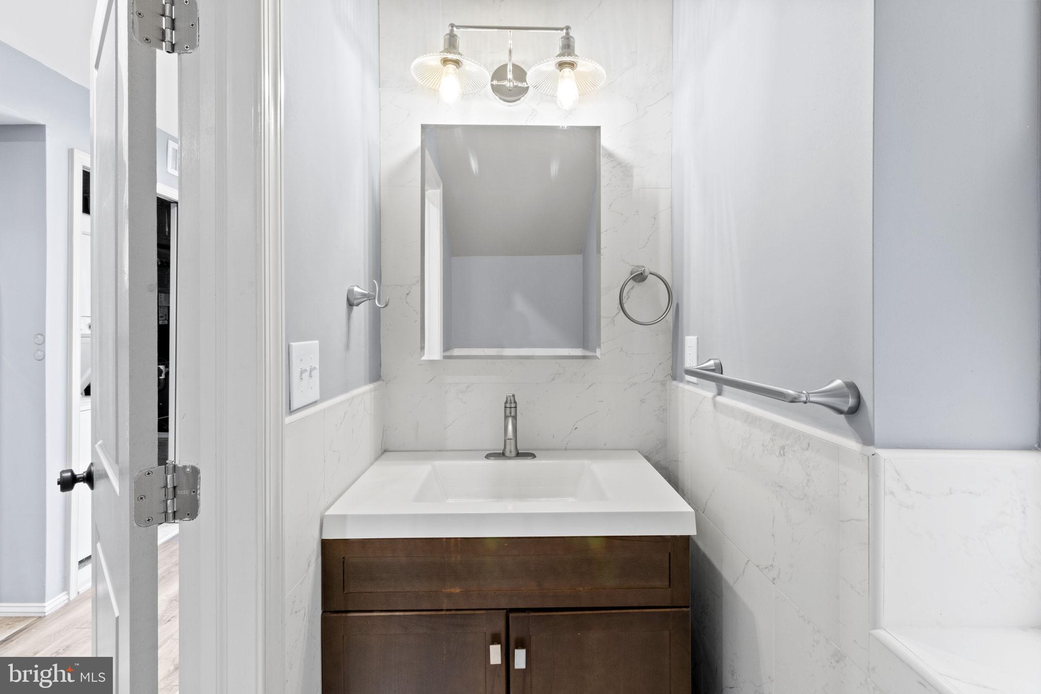 418 South 15th Street, Unit 2R Philadelphia, PA 19146 - Photo 13 of 26 a bathroom with a sink and mirror