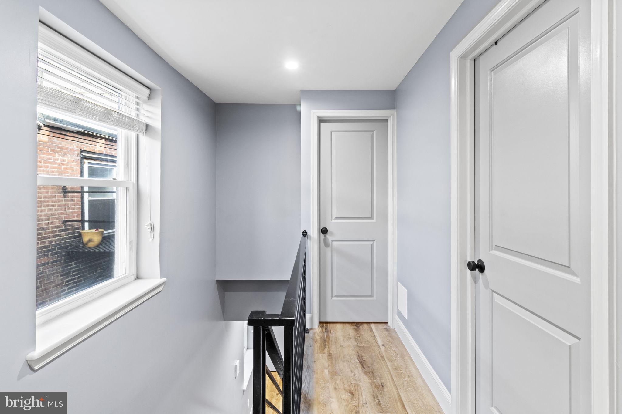 418 South 15th Street, Unit 2R Philadelphia, PA 19146 - Photo 18 of 26 a view of a hallway with a wooden door
