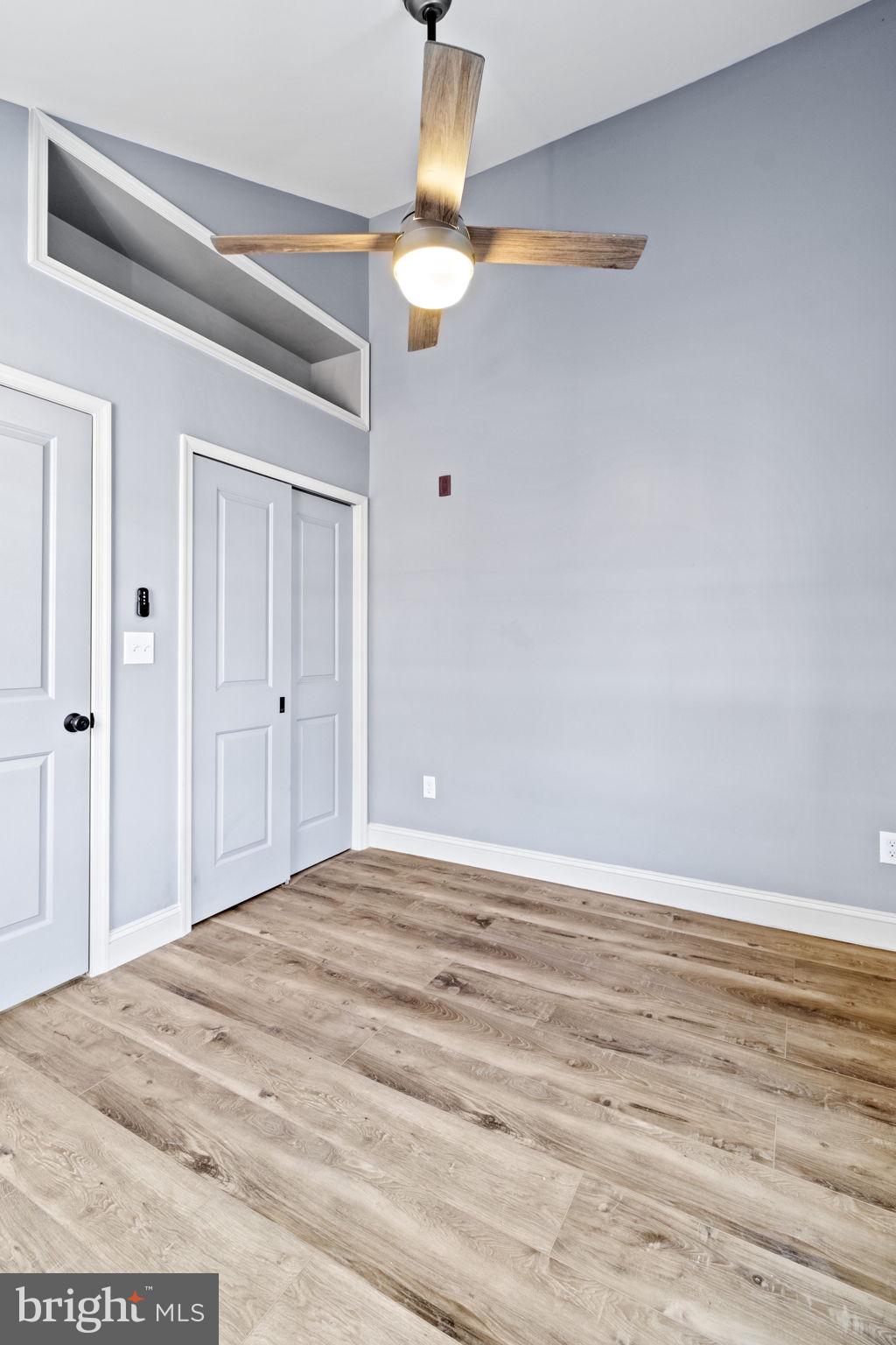 418 South 15th Street, Unit 2R Philadelphia, PA 19146 - Photo 26 of 26 a view of a livingroom with wooden floor and a ceiling fan