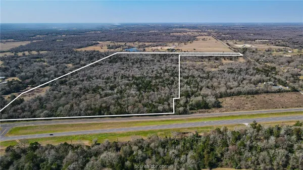 a view of a swimming pool and a yard