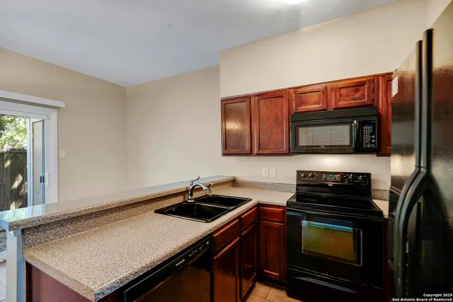 a kitchen with a stove and a microwave