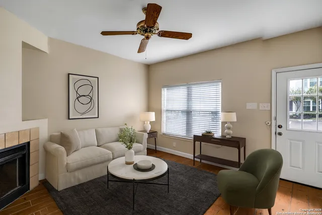 a living room with furniture and a window