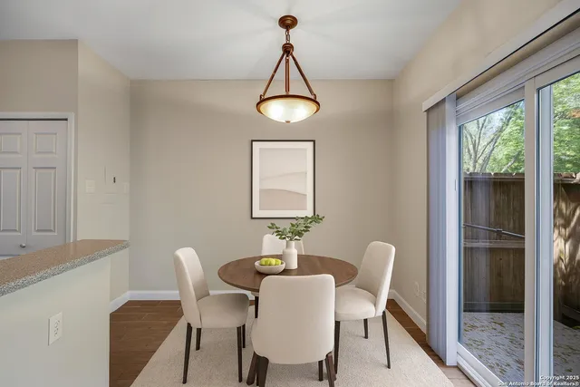 a view of a dining room with furniture window and outside view