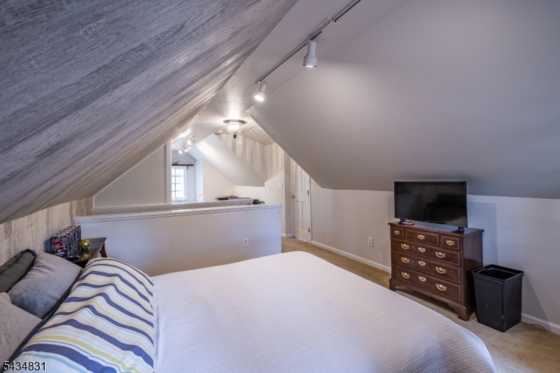 200 Wychwood Road Westfield, NJ 07090 - Photo 24 of 31 a bedroom with a bed and a television