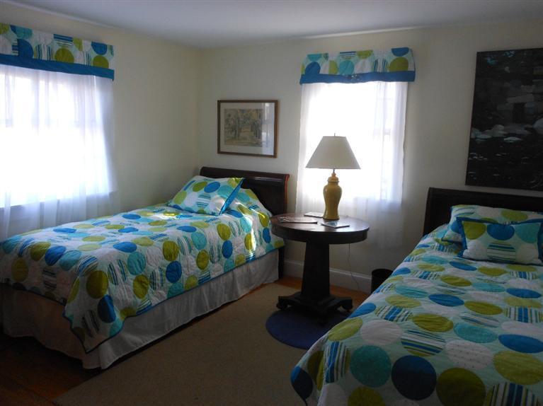 13 Shannon Road Harwich, MA 02645 - Photo 12 of 18 a bedroom with a bed lamp and a window