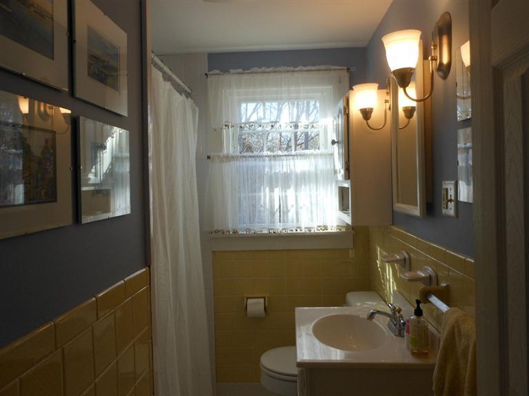 13 Shannon Road Harwich, MA 02645 - Photo 13 of 18 a bathroom with a sink a mirror and a toilet